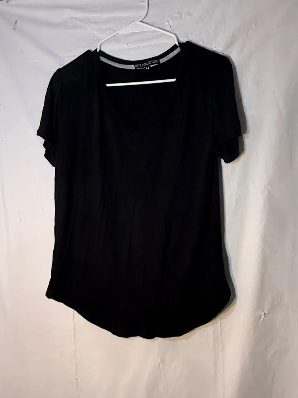 Elite Collection brand black short sleeve V neck women’s shirt size medium